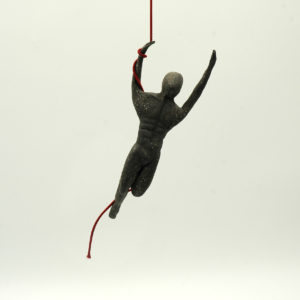 Ceramic black acrobat with red rope