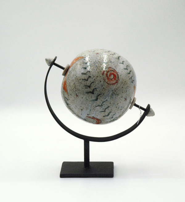 Decorative ceramic globe on a metal base