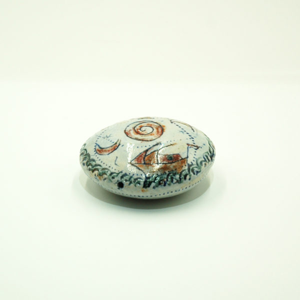 Ceramic rattle paperweight with seascape decoration